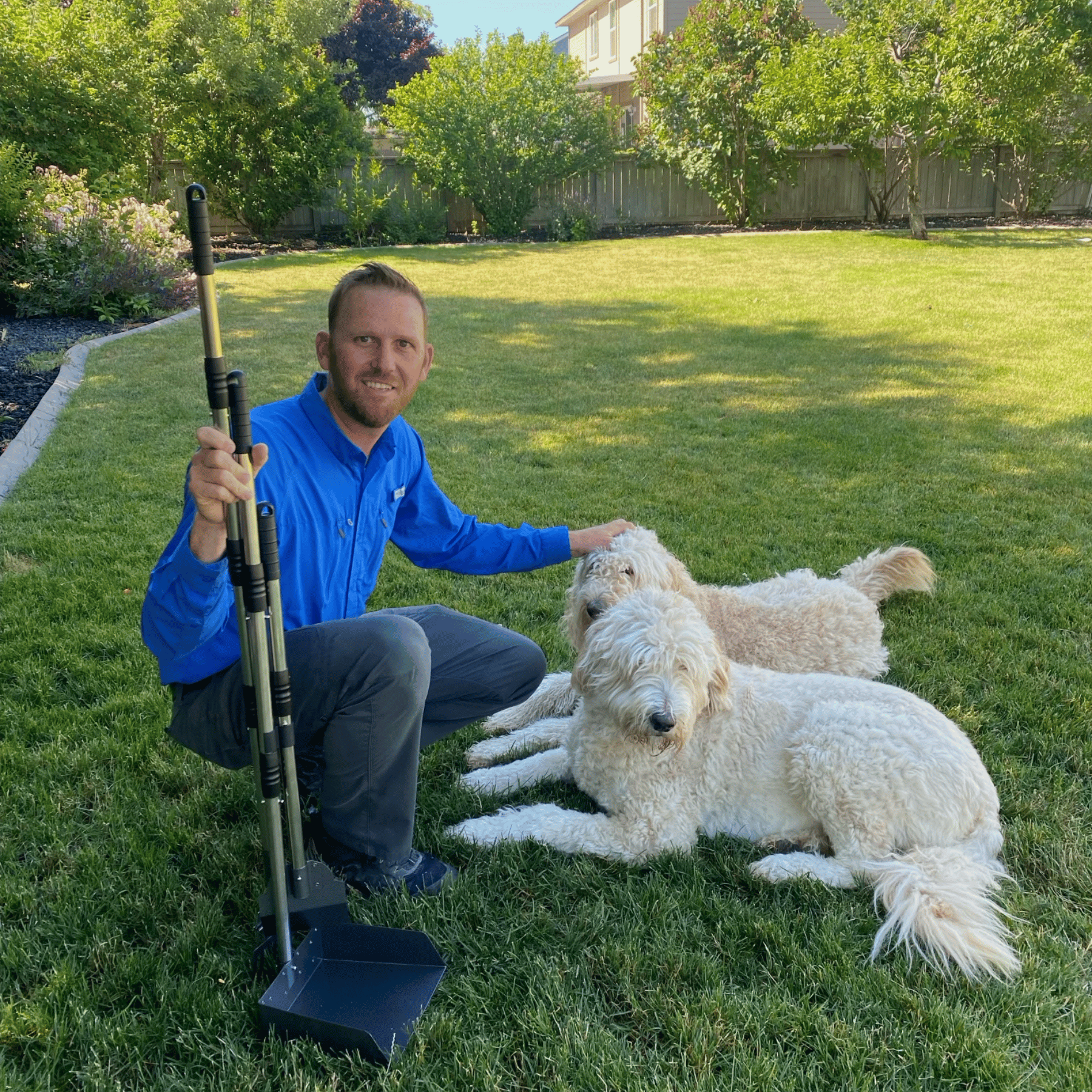 man holding poop scooping shovel and rake